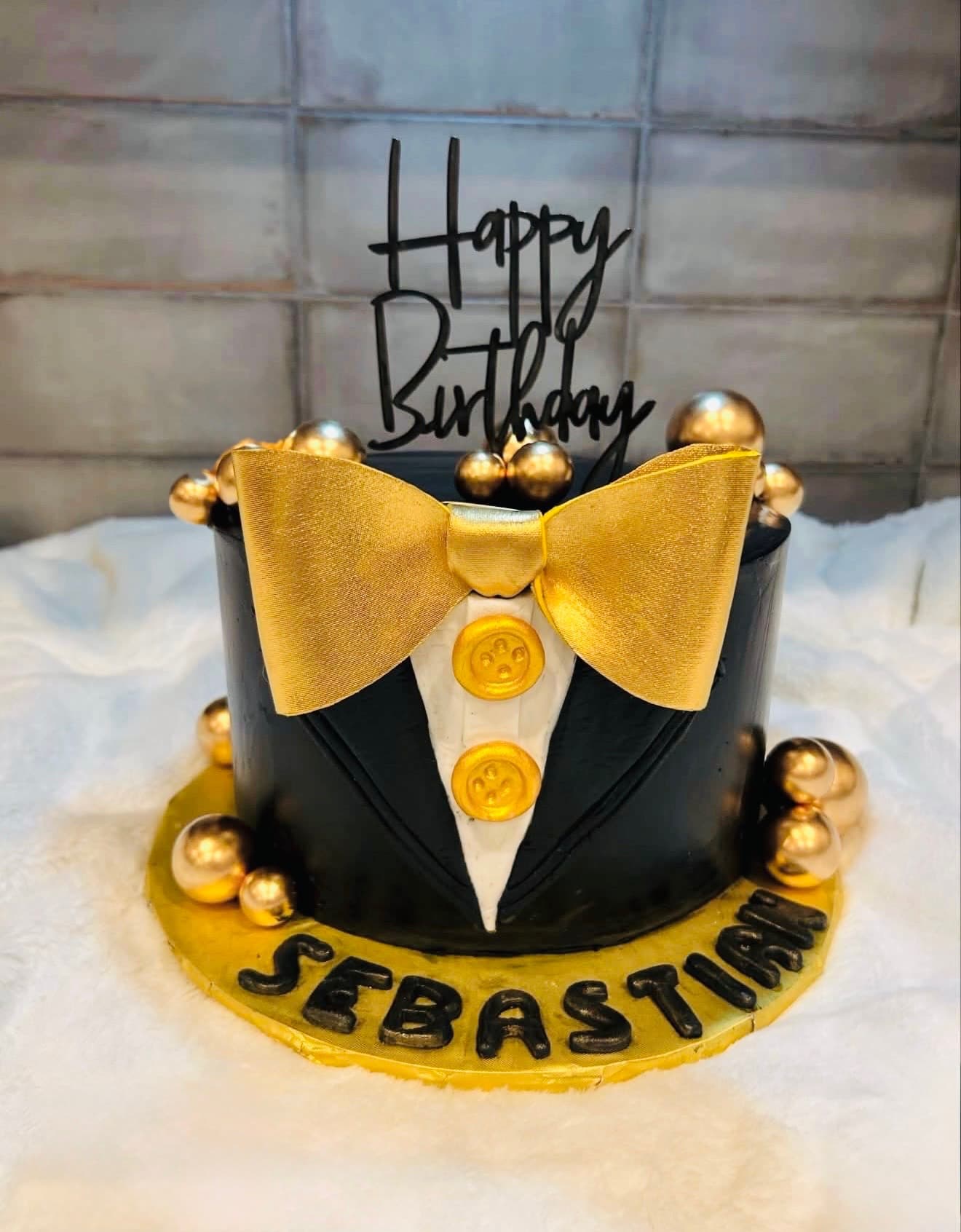 Black and gold tuxedo birthday cake