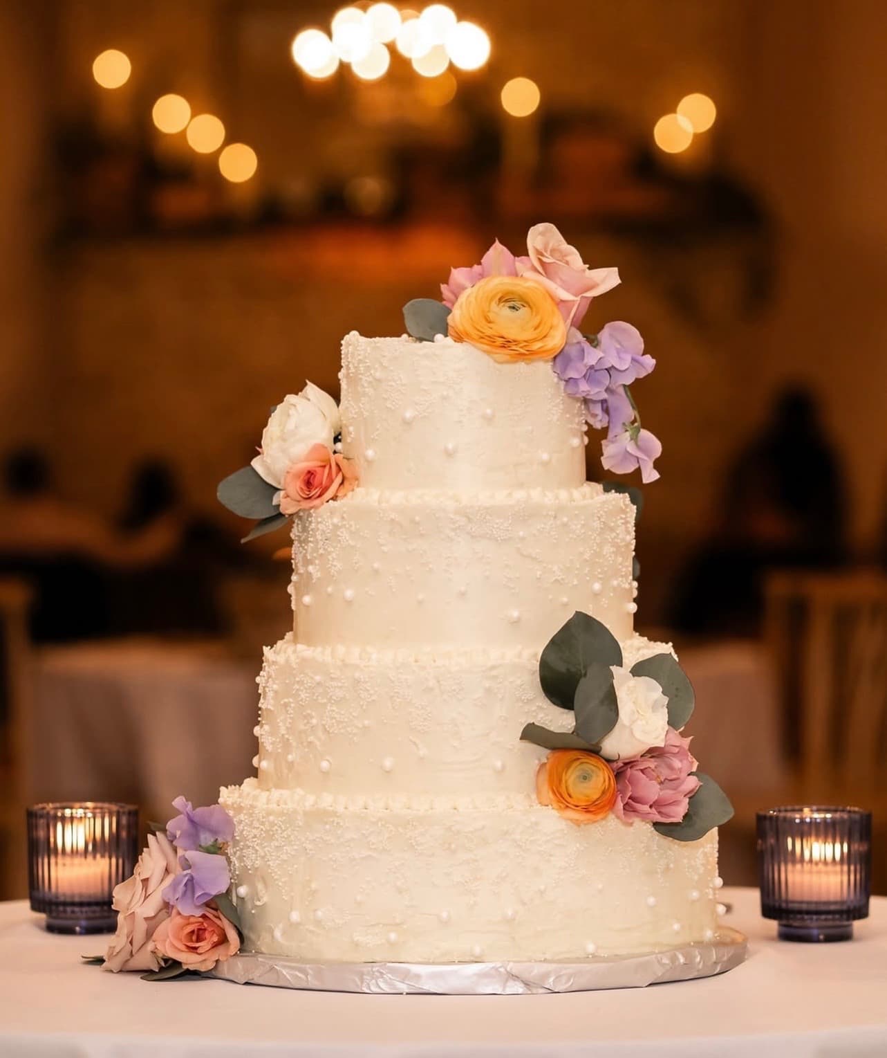 Elegant tiered wedding cake with floral decorations